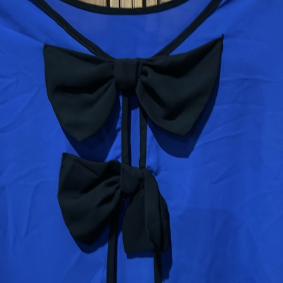 Sheer bright blue top with black bows on back. It’s a large by Agaci. - Picture 5 of 5